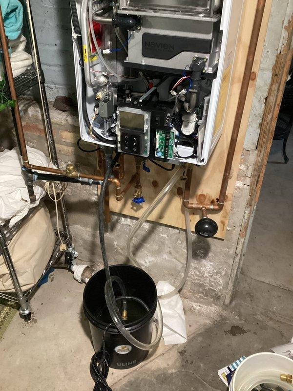 Performed scheduled maintenance on customer's Navien tankless water heater, including a comprehensive flush of the system to remove mineral buildup and sediment. Inspected and cleaned the intake screen to ensure proper airflow and optimal combustion. Completed full diagnostic check of internal components and verified proper operation after service was completed.