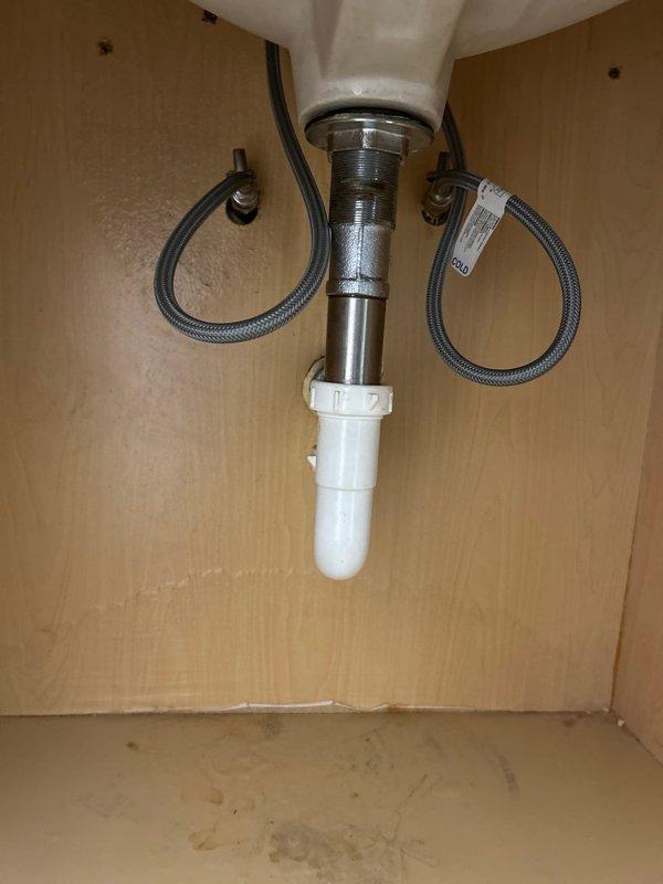 Responded to priority service call regarding lack of hot water in both bathrooms with slow overall flow. Upon inspection, found partially clogged cartridge in sink valve assembly and mineral buildup in supply lines. Cleaned cartridge, flushed supply lines, and verified proper connection of braided supply hoses. Performed preventative maintenance on water heater per customer request. All bathroom fixtures now receiving adequate hot water flow.