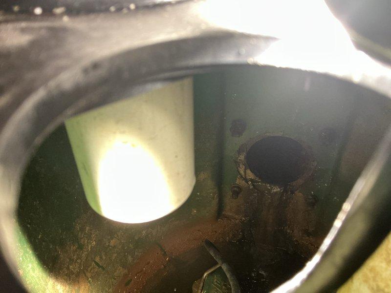 Performed complimentary camera inspection of drainage system as scheduled, requiring removal and resealing of ejector pit cover. Inspection revealed signs of corrosion and mineral deposits inside the plumbing infrastructure, with particular attention to the cylindrical metal components showing oxidation around connection ports.