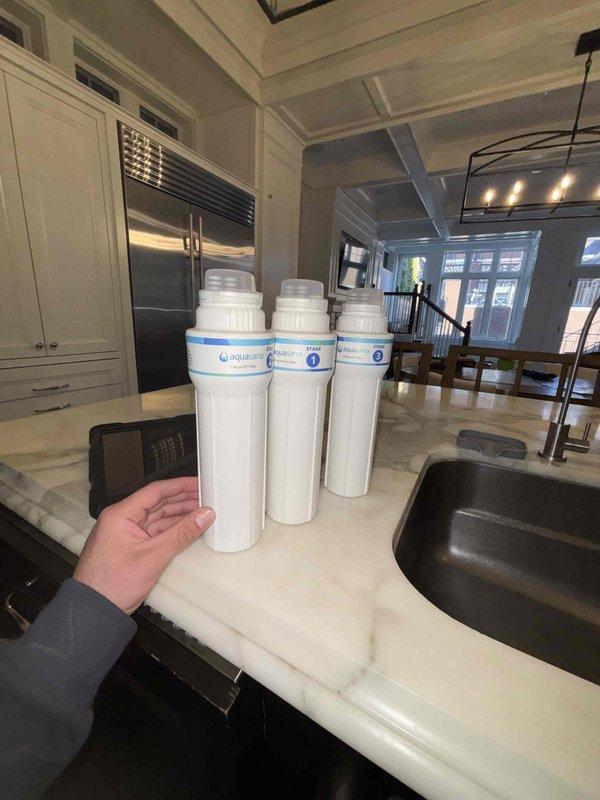 Successfully installed an Aquasana under-sink water filtration system and InSinkErator air switch button in customer's kitchen. Worked in confined cabinet space with existing plumbing configuration, properly connecting the filtration system and ensuring all components were securely mounted and functional.
