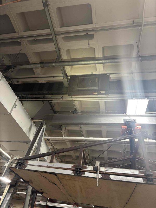 Conducted site assessment for potential tankless water heater conversion in commercial/industrial facility. Evaluated existing structure, ceiling infrastructure, and utility access points to determine feasibility. Customer requires hot water solution for industrial application; recommended tankless system as appropriate option based on space constraints and application requirements.