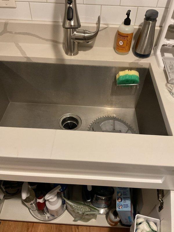 Responded to service call regarding backed up kitchen sink and dishwasher that began malfunctioning the previous day. Upon inspection of both appliances, discovered a blockage in the shared drain line causing water to back up into both fixtures. Successfully cleared the clog using professional drain cleaning equipment, restoring proper drainage function to both the sink and dishwasher.