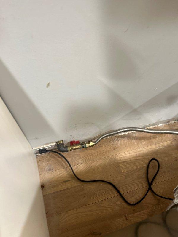 Relocated an existing gas line with proper fittings and installed a new shutoff valve in customer's home. Work included installation of flexible metal connector and securing all components to ensure safe operation of gas supply.