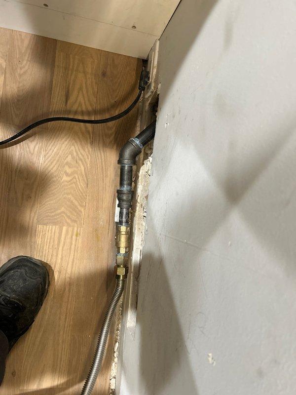 Relocated an existing gas line with proper fittings and installed a new shutoff valve in customer's home. Work included installation of flexible metal connector and securing all components to ensure safe operation of gas supply.