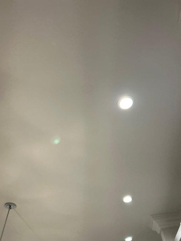 Conducted leak inspection in response to customer's concern about water damage appearing on kitchen ceiling below washing machine. Visual assessment revealed ceiling damage near recessed lighting, including visible tearing/cracking in drywall consistent with water intrusion. Performed thorough examination of plumbing connections at washing machine location to identify source of leak.