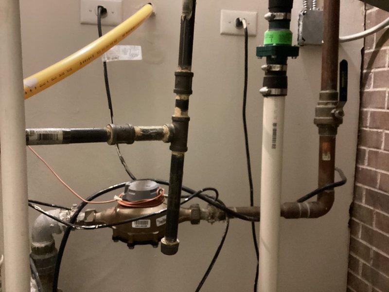Inspected existing plumbing infrastructure throughout utility area, including copper pipes, PVC connections, and water meter. Parts for faucet installation are in shop; needs scheduling. Job to be completed by Brian R or Chip as per sales arrangement.
