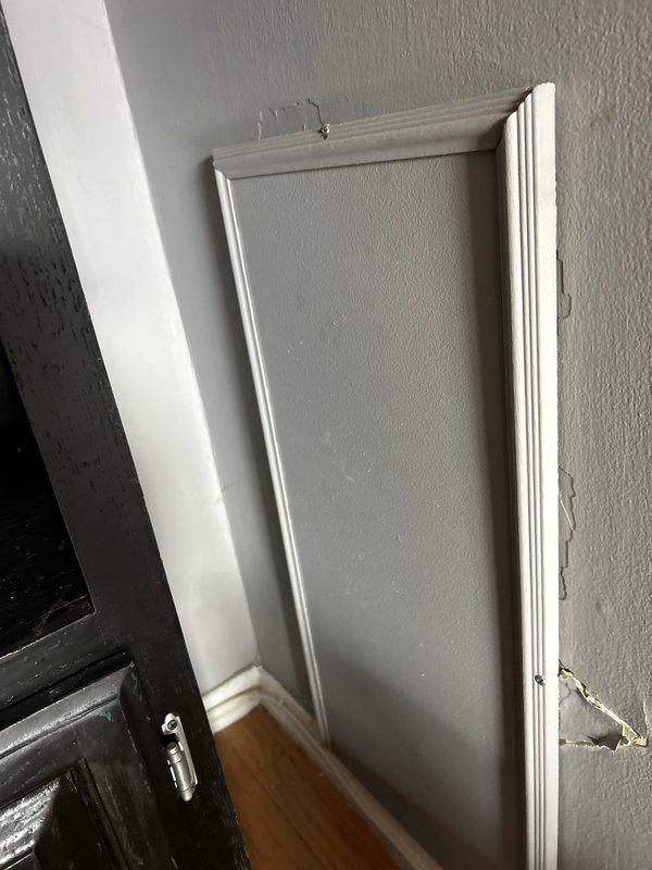 Responded to a priority service call to address damaged wall panel and plumbing valve issue. Replaced faulty bathtub valve assembly with new component featuring green indicator buttons. Repaired damaged drywall section near the door frame where surface material had cracked.