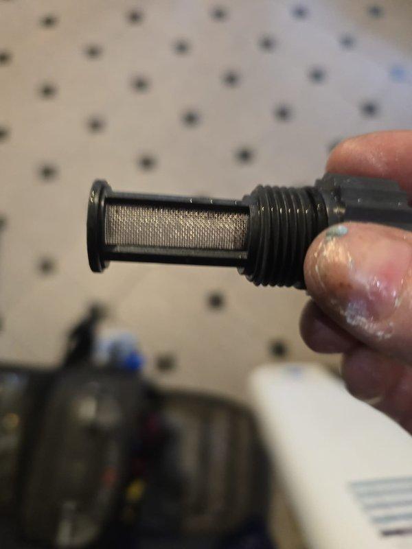 Addressed intermittent hot water supply issue in third floor apartment by inspecting water heater system. Identified and removed clogged inlet filter screen causing flow restriction. Cleaned debris from temperature sensor prongs to restore proper temperature regulation. System now functioning correctly with consistent hot water delivery.