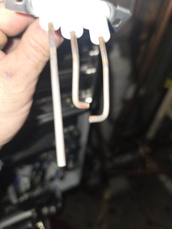 Addressed intermittent hot water supply issue in third floor apartment by inspecting water heater system. Identified and removed clogged inlet filter screen causing flow restriction. Cleaned debris from temperature sensor prongs to restore proper temperature regulation. System now functioning correctly with consistent hot water delivery.