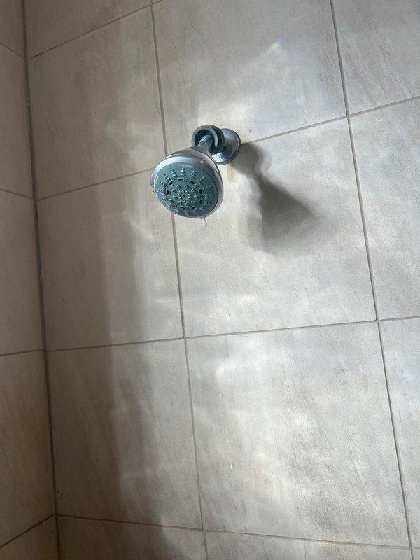 Replaced leaking shower head in customer's bathroom. Removed old chrome shower head and installed new fixture, ensuring proper connection to existing plumbing. Tested for proper water flow and verified no leaks at connection points.