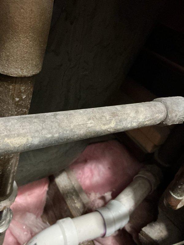 Resolved shower/tub drainage issue by removing broken drain stopper that was stuck in closed position. Accessed plumbing through wall access point to inspect and repair the antiquated spring mechanism. Replaced complete drain open/close assembly with new components, ensuring proper functionality and water drainage.