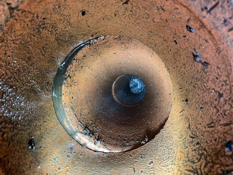 Responded to priority service call for flooding and non-functioning water heater. Inspection revealed clogged clay drainage pipe. Successfully cleared blockage using hand tools and verified proper water flow restoration. Documented condition with photos showing access point and interior pipe condition before completion.