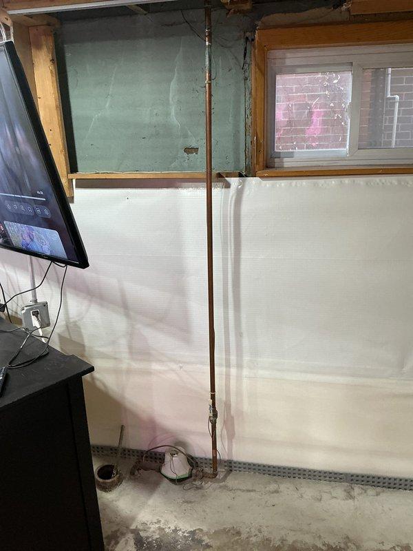 Conducted on-site assessment for potential lead service line replacement. Inspected existing plumbing infrastructure in basement utility area, including copper vertical pipe sections and drainage assembly. Documented current setup with photos to develop appropriate replacement strategy.