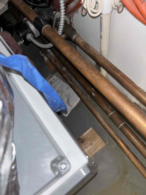 Performed annual water heater maintenance service. Inspected copper supply lines and fittings for signs of corrosion or leaks. Examined TPR valve, connections, and verified proper function of shut-off valves. All components showing normal aging but remain in functional condition with no immediate concerns identified.