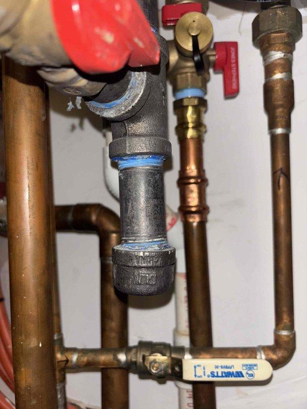 Performed annual water heater maintenance service. Inspected copper supply lines and fittings for signs of corrosion or leaks. Examined TPR valve, connections, and verified proper function of shut-off valves. All components showing normal aging but remain in functional condition with no immediate concerns identified.