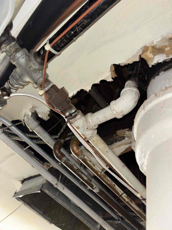 Responded to service call for two slow-draining bathroom sinks and gas line capping. Upon inspection of plumbing infrastructure, discovered significant blockage in drainage pipes requiring clearing. Located gas line in utility room near water heater and HVAC system, and properly capped it according to safety protocols. Successfully restored proper drainage to both bathroom sinks, ensuring normal water flow.