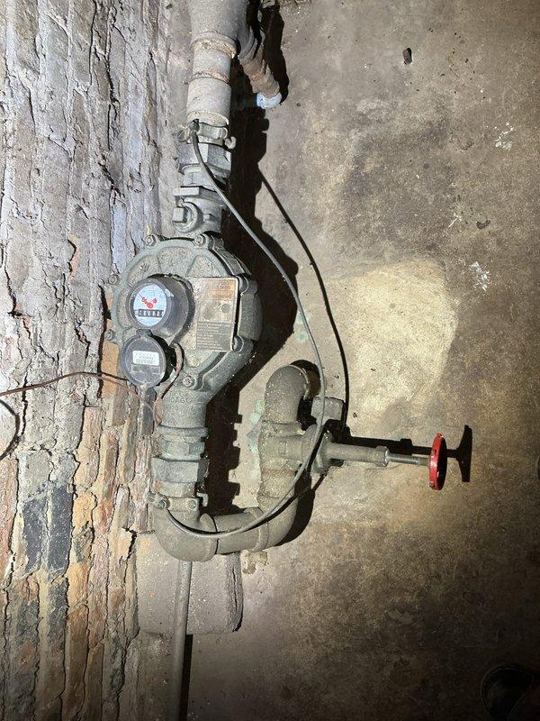 Completed inspection of existing backflow prevention system with significant aging and deterioration. Documented extensive corrosion on main water supply pipes and valve assemblies against concrete wall. Photos taken to support estimate for replacement of deteriorated components and valves.