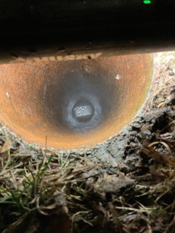 Performed warranty power rodding service using Speedrooter equipment to clear copper drain line showing significant interior corrosion and blockage. Successfully restored proper drainage through the affected pipe, which showed signs of oxidation and aging.