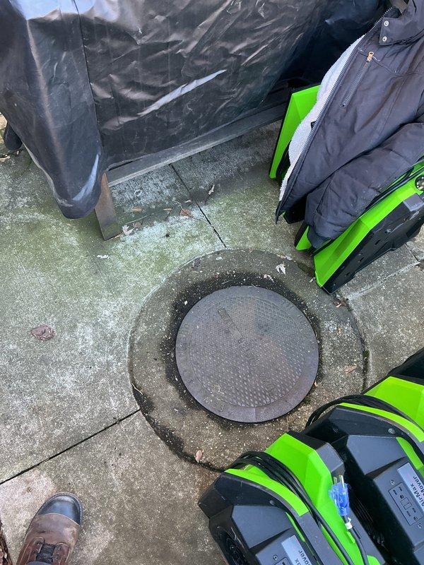 Performed service call transferred from Frank to Jon. Accessed manhole opening to inspect sewer line. Identified stagnant water and significant buildup in the drain pipe with visible deterioration and sediment accumulation. Documented condition with photos for assessment of necessary remediation.