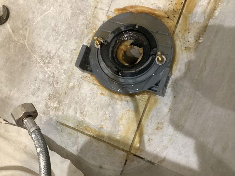 Responded to warranty call regarding persistent odor issues after previous toilet installation. Upon inspection, found improper wax ring seal at the toilet base causing sewer gas to escape. Removed toilet, cleaned old wax residue, installed new wax ring with proper seal, and securely reseated toilet. Confirmed proper operation and elimination of odor issue.