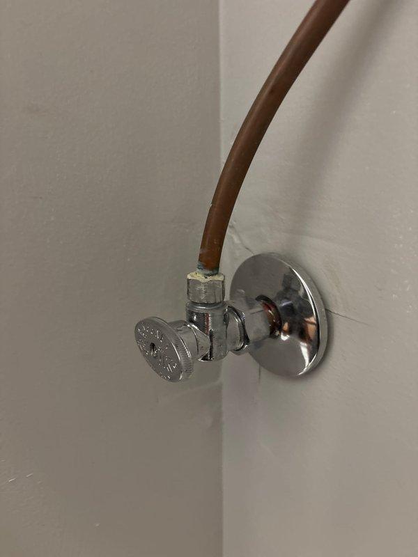 Responded to a service call for a leaking steam shower supply line. Inspected the chrome water shut-off valve and associated copper supply line. Located and repaired the leak at the compression fitting where the copper line connects to the valve assembly. Tested the system to confirm proper function with no further leakage.