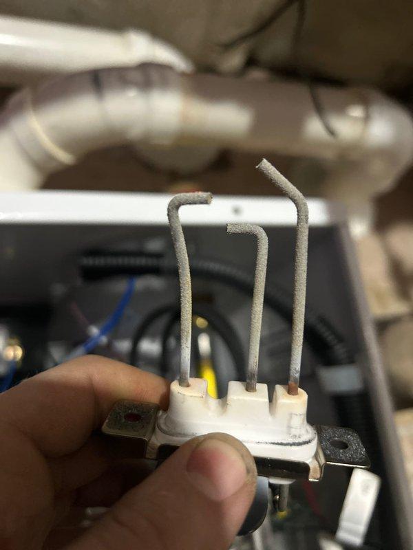 Responded to urgent service call for non-functioning boiler causing significant temperature drop in commercial facility. Upon inspection, identified oxidized ignition electrodes as the source of failure. Tested electrical components with multimeter to verify proper voltage at control panel. Replaced damaged igniter assembly to restore normal heating operation.