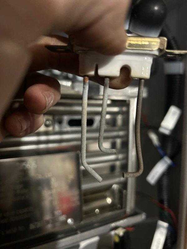 Responded to urgent service call for non-functioning boiler causing significant temperature drop in commercial facility. Upon inspection, identified oxidized ignition electrodes as the source of failure. Tested electrical components with multimeter to verify proper voltage at control panel. Replaced damaged igniter assembly to restore normal heating operation.