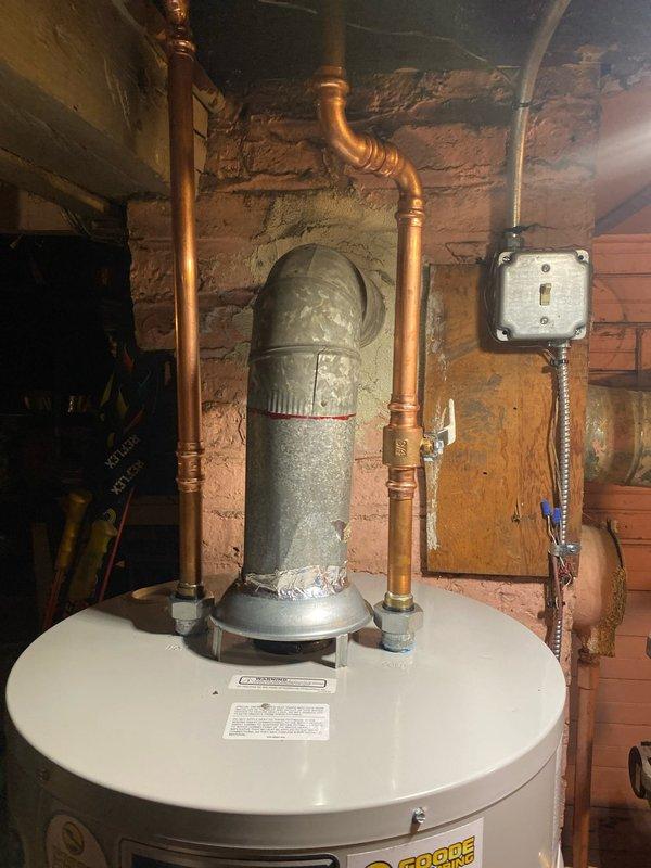 Completed warranty service on water heater by replacing gas valve and ignition assembly. Raised heater to proper height according to specifications (approximately 10 inches from floor) and verified proper installation. Parts were sourced from Ferguson on Western as per work order.