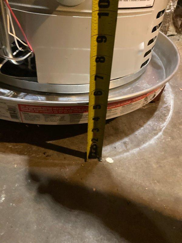 Completed warranty service on water heater by replacing gas valve and ignition assembly. Raised heater to proper height according to specifications (approximately 10 inches from floor) and verified proper installation. Parts were sourced from Ferguson on Western as per work order.