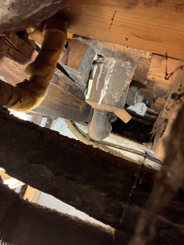 Responded to service call for bathtub drainage issue and toilet instability. Upon inspection of the crawlspace, identified deteriorated wooden structural supports and compromised plumbing connections. Repaired damaged pipe fittings and reinforced floor joists beneath bathroom fixtures to restore proper drainage and stabilize toilet mounting.