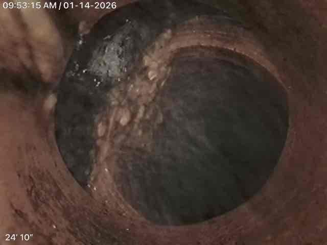 Performed camera inspection of basement drain line as requested by client. Inspection revealed evidence of corrosion and mineral buildup on interior pipe walls. Camera reached approximately 24'10" into the line, documenting potential deterioration and uneven surfaces that may require future attention.