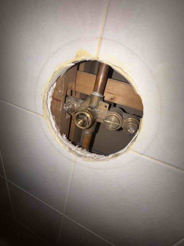 Conducted initial assessment of kitchen sink plumbing system and bathroom shower valve assembly. Created access point in ceiling/wall to inspect copper pipes and brass fittings. BASI scheduled to return tomorrow morning to complete necessary repairs, with both customer and BASI confirmed aware of the follow-up appointment.