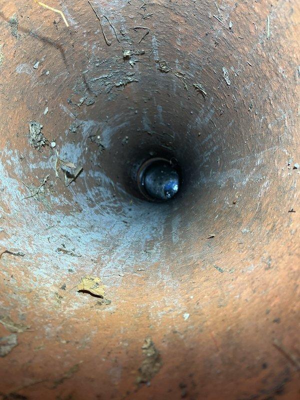 Performed priority call back service to conduct video inspection of sewer line. Located access point in yard and inspected clay pipe for potential blockages or damage. Captured footage of pipe interior showing some wear, mineral deposits, and minor debris. Further estimates for underground repairs will be provided based on inspection findings.