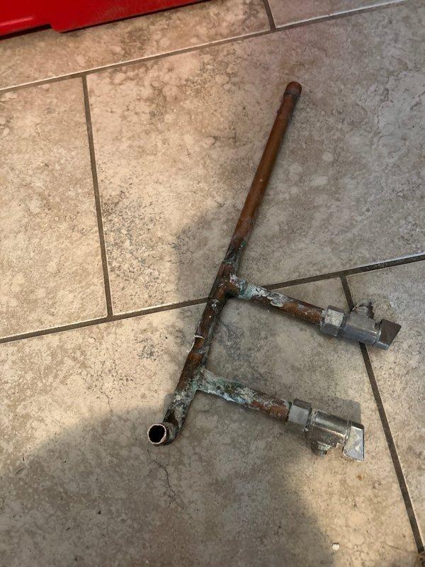 Responded to service call at rental property for faucet repair. Upon inspection, discovered severely corroded copper supply lines with significant verdigris formation and deterioration at connection points. Removed and replaced damaged copper T-fitting and associated piping to restore proper water flow and prevent potential leaks. All work was completed during morning appointment as requested.