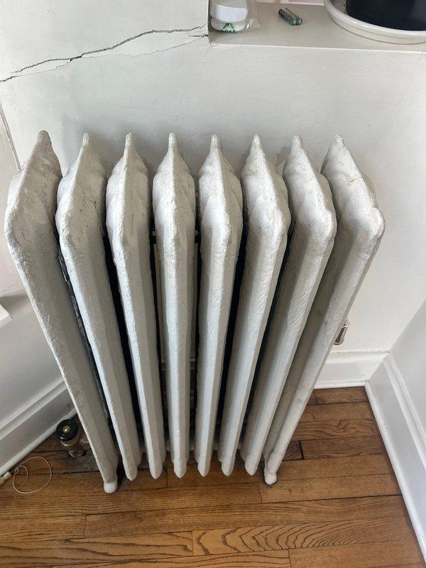 Responded to warranty service call regarding noise from recently installed radiator. Upon inspection of the cast iron radiator, identified normal expansion/contraction sounds during heating cycles. Explained to customer that these sounds are typical for this style of radiator and do not indicate any functional issues. No repairs needed as system is operating within normal parameters.