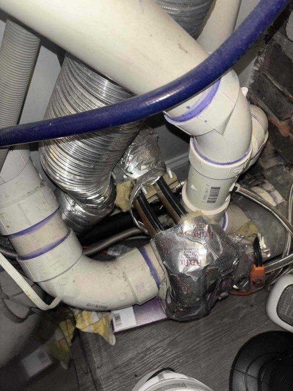 Relocated refrigerator water supply line from laundry room to position directly behind refrigerator installation location. Work involved rerouting PVC supply lines with appropriate fittings and connecting flexible water line to accommodate new appliance placement.
