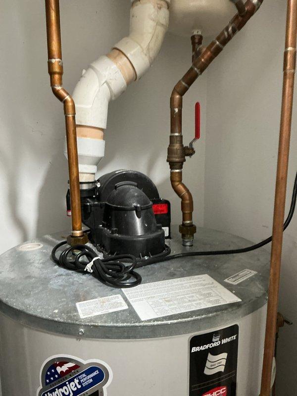 Responded to customer complaint of insufficient hot water in shower lasting only 30 seconds. Inspected Bradford White water heater system with Icon System control panel. Diagnosed and serviced the recirculation pump mounted above the water heater to restore proper hot water delivery to shower fixtures.