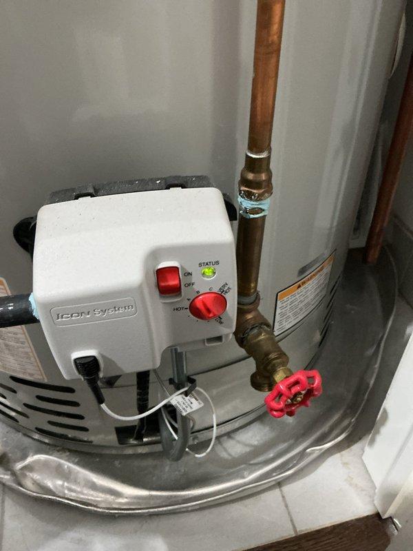 Responded to customer complaint of insufficient hot water in shower lasting only 30 seconds. Inspected Bradford White water heater system with Icon System control panel. Diagnosed and serviced the recirculation pump mounted above the water heater to restore proper hot water delivery to shower fixtures.