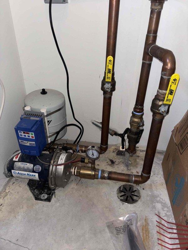 Responded to customer complaint of loud noise from Aqua Magic booster pump system. Inspected Leeson electric motor and found excessive vibration during operation. Tightened loose mounting bolts, replaced worn impeller, and cleaned debris from pump housing to eliminate noise. System now operating at normal noise levels with proper pressure maintained.