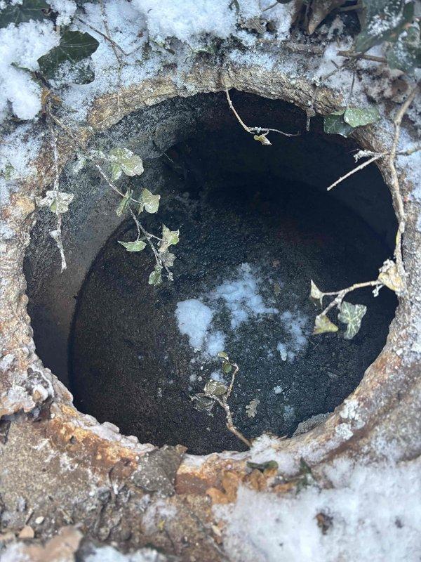 Performed inspection of residential sewer system by accessing two key points: a small pipe opening surrounded by vegetation and a standard municipal manhole. Visual examination revealed standing water in the manhole chamber. Service included providing customer with estimate for main sewer and water line jetting to address potential blockage issues.
