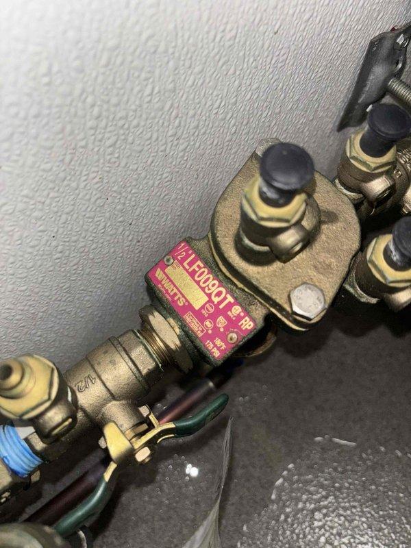 Responded to work order #237644 to investigate strong sewer odor in restroom. Performed smoke test to identify source of odor. Inspection revealed significant mineral buildup and corrosion in floor drain, and issues with the plumbing valve assembly that were contributing to the sewer gas smell.
