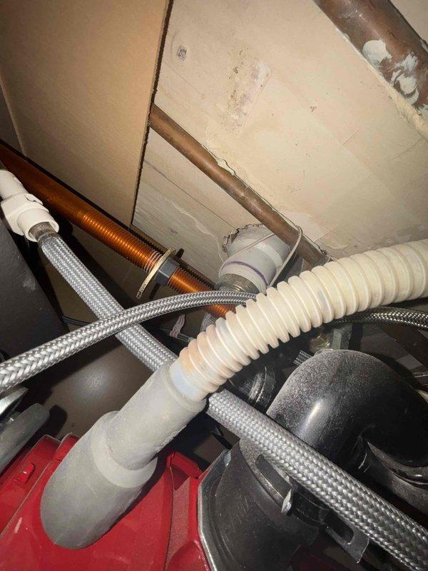 Responded to priority service call for kitchen faucet repairs. Inspected under-sink plumbing system which revealed corroded copper pipe section and compromised supply lines. Replaced damaged components including P-trap assembly and installed new braided stainless steel supply lines to restore proper functionality and prevent leakage.