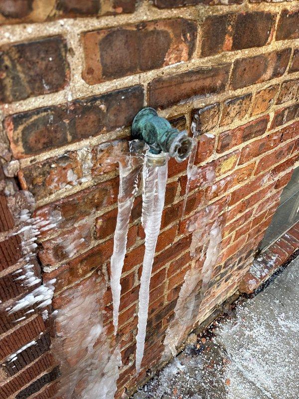 Repaired frozen outdoor spigot that had been leaking due to damaged cap. Inspected interior structural area to assess water damage to surrounding materials, including deteriorated insulation and drywall. Restored functionality to the spigot and addressed ice formation that had developed on exterior brick wall.