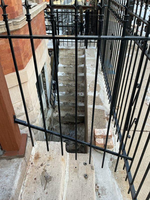 Conducted a callback service for Jon, inspecting basement access area with signs of water damage. Observed significant deterioration of wooden structural components in crawlspace and documented condition with photos. Identified potential moisture intrusion issues near exterior stairwell with wrought iron railings.