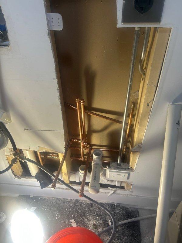 Opened wall section to access and repair plumbing infrastructure. Installed new copper supply lines and PVC drain pipes, ensuring proper connection to existing system. Coordinated with electrical components during the repair process to maintain code compliance.