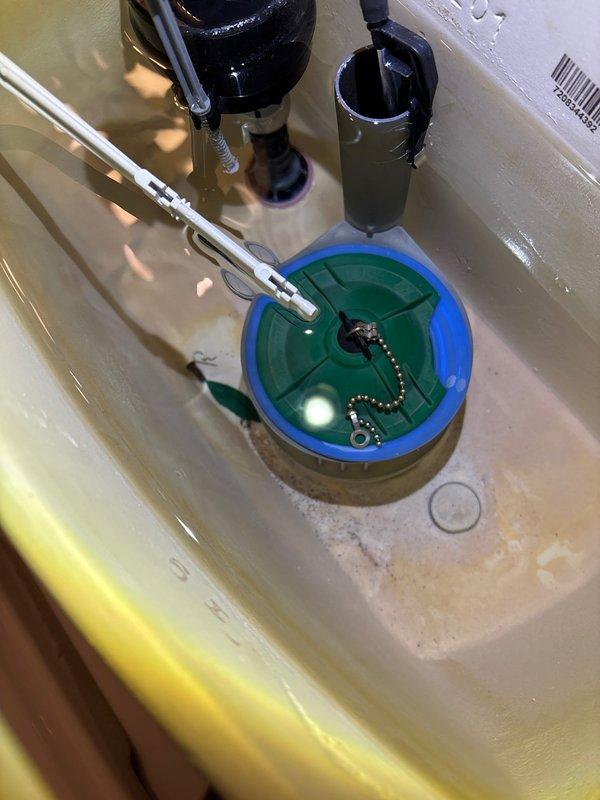 Diagnosed and repaired a running toilet issue by replacing the faulty flush valve assembly that was preventing proper chain latching. Removed tank lid, inspected internal components, and installed new flush valve mechanism to restore proper flushing function and eliminate continuous water flow.