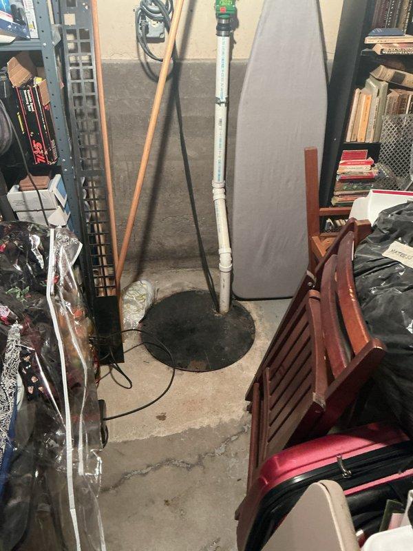 Responded to customer complaint of recurring basement flooding during rainfall. Inspection revealed water seepage through floor tiles without proper drainage system. Installed sump pump with PVC discharge piping to address the long-standing issue. Also examined existing drainage plumbing, which showed sediment accumulation at pipe bases requiring cleaning to ensure proper water evacuation.