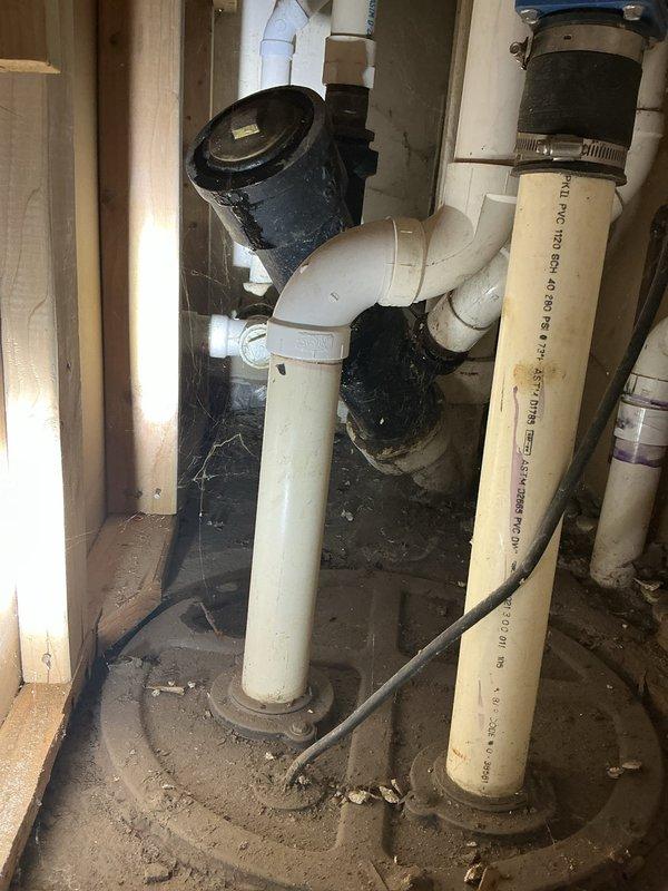 Responded to customer complaint of recurring basement flooding during rainfall. Inspection revealed water seepage through floor tiles without proper drainage system. Installed sump pump with PVC discharge piping to address the long-standing issue. Also examined existing drainage plumbing, which showed sediment accumulation at pipe bases requiring cleaning to ensure proper water evacuation.