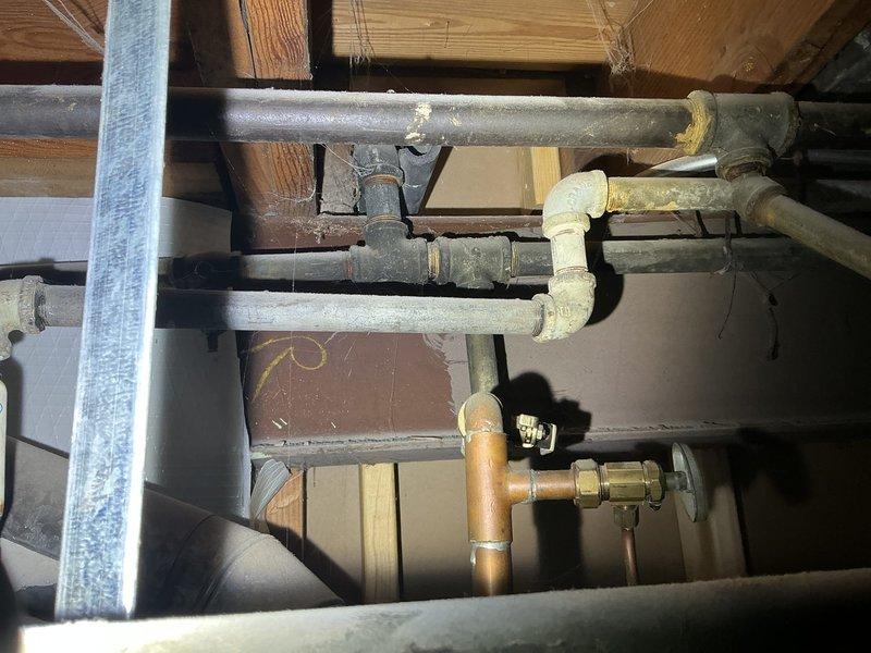 Conducted assessment for basement bathroom and laundry room rough-in project. Inspected existing plumbing infrastructure, noting aged cast iron/galvanized piping with visible corrosion at joints, along with more recent PVC and copper pipe installations. Documented current configuration of supply lines, drainage system, and shutoff valves to develop comprehensive quote for new fixture installations and necessary upgrades to existing plumbing system.