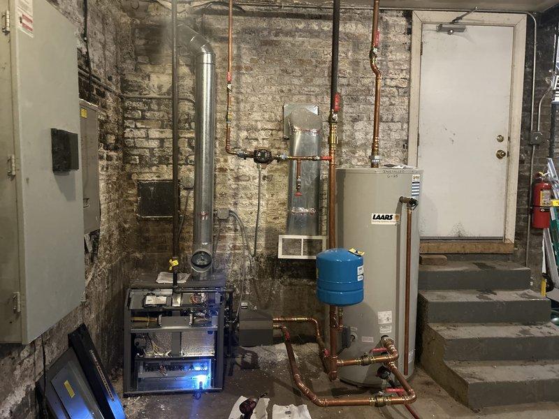 Performed scheduled maintenance on LAARS commercial tanked water heater system per VIP client request. Completed comprehensive flush procedure to remove sediment buildup and inspected all connections. System operating normally with proper venting through exhaust pipe and expansion tank functioning as designed.